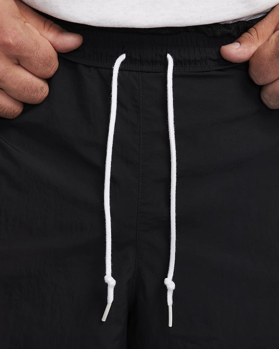 Black nike tracksuit white stripe best sale